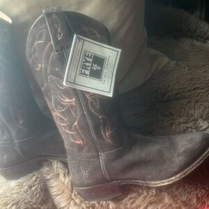 Frye cowboy boots with embroidered stitching.